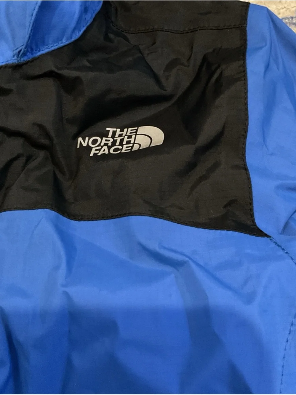 The North Face Blue and Black Kids' Raincoat Hooded Jacket